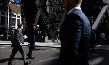 City workers are seen walking in the City of London