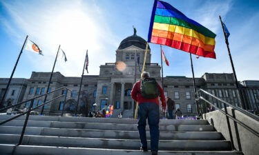 Montana will comply with a court order requiring it to enforce a process that makes it easier for residents to change the sex designations on their birth certificates. Supporters of LGBTQ rights are pictured here on the steps of the Montana State Capitol.