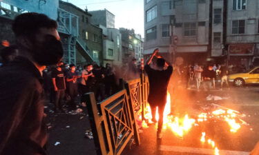 People light a fire during a protest over the death of Mahsa Amini in Tehran on September 21.