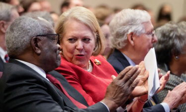 Associate Supreme Court Justice Clarence Thomas sits with his wife Ginni Thomas at the Heritage Foundation in October 2021. Ginni Thomas has agreed to an interview with the January 6 committee.