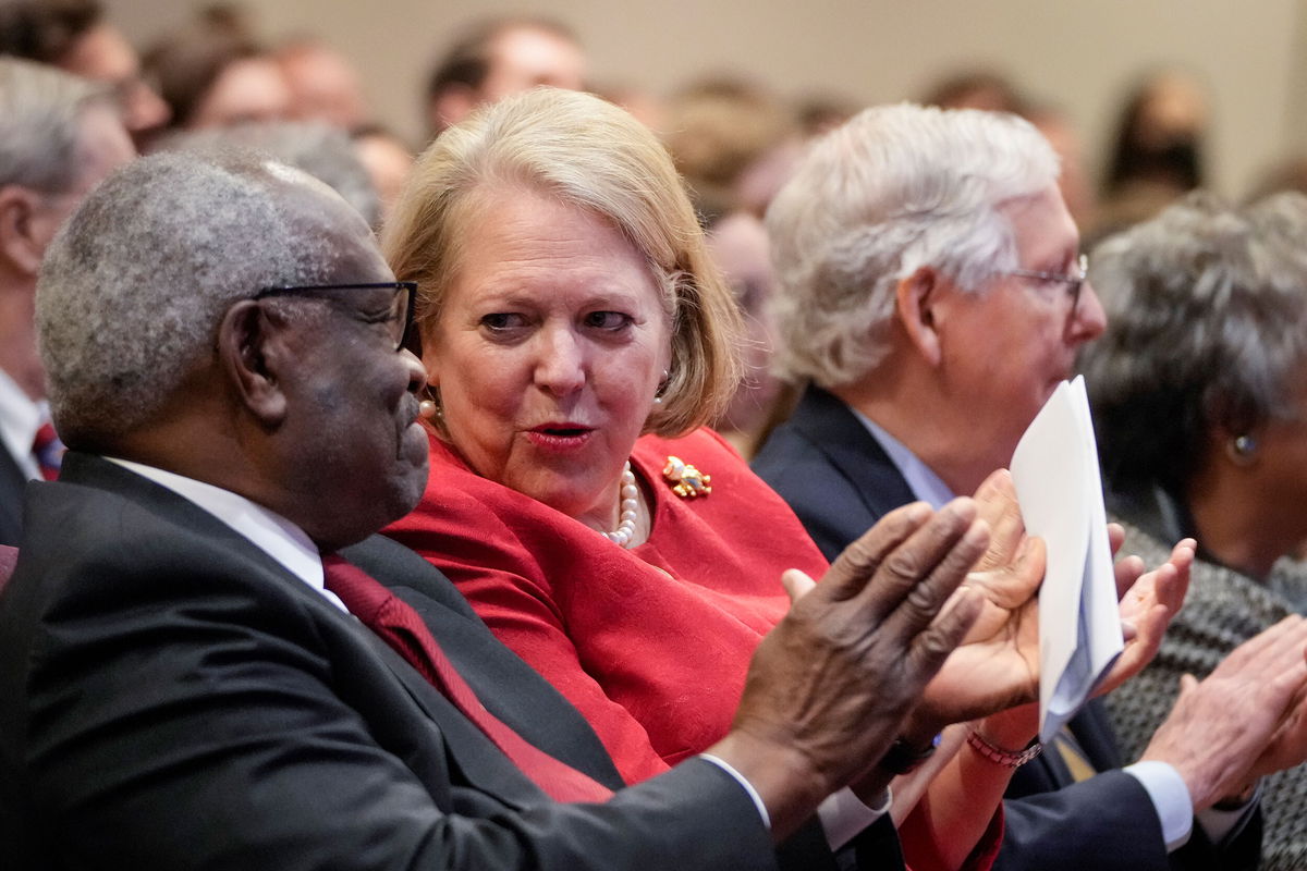 <i>Drew Angerer/Getty Images/FILE</i><br/>Associate Supreme Court Justice Clarence Thomas sits with his wife Ginni Thomas at the Heritage Foundation in October 2021. Ginni Thomas has agreed to an interview with the January 6 committee.