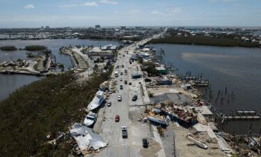 An aerial picture taken on September 29 shows washed up boats on a street in the aftermath of Hurricane Ian in Fort Myers
