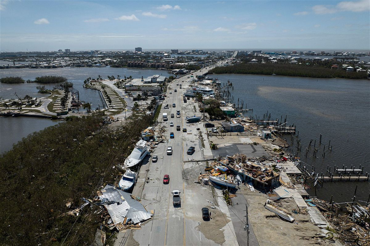 <i>Ricardo Arduengo/AFP/Getty Images</i><br/>An aerial picture taken on September 29 shows washed up boats on a street in the aftermath of Hurricane Ian in Fort Myers