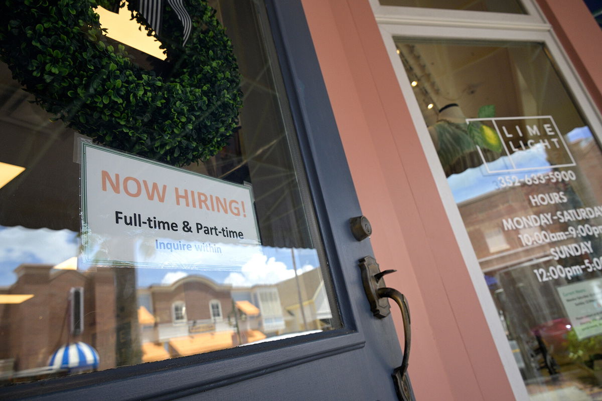 <i>Phelan M. Ebenhack/AP</i><br/>Small business sentiment improved in August but remains depressed as business owners face an uncertain economic landscape. A Now Hiring sign is seen here at the entrance of a small retail business in the Lake Sumter Landing Market Square district.