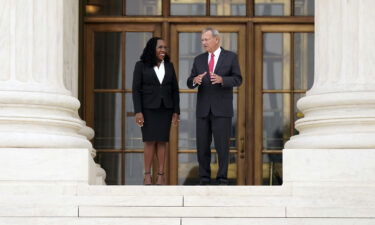 Justice Ketanji Brown Jackson (left) stands outside the Supreme Court with Chief Justice John Roberts following her formal investiture ceremony on September 30.