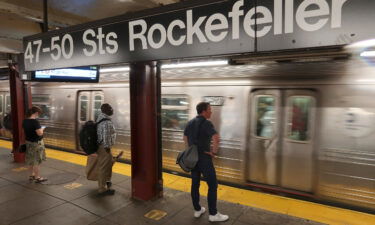 People wait to board a train at the 47 -50 Sts - Rockefeller Center subway station on July 15 in New York City. New York City faces a potential fiscal cliff with a nearly $10 billion deficit by 2026.