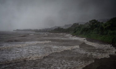 Waves generated by Typhoon Nanmadol break along the coast in Izumi