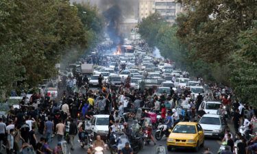 Protesters chant slogans during a protest in downtown Tehran