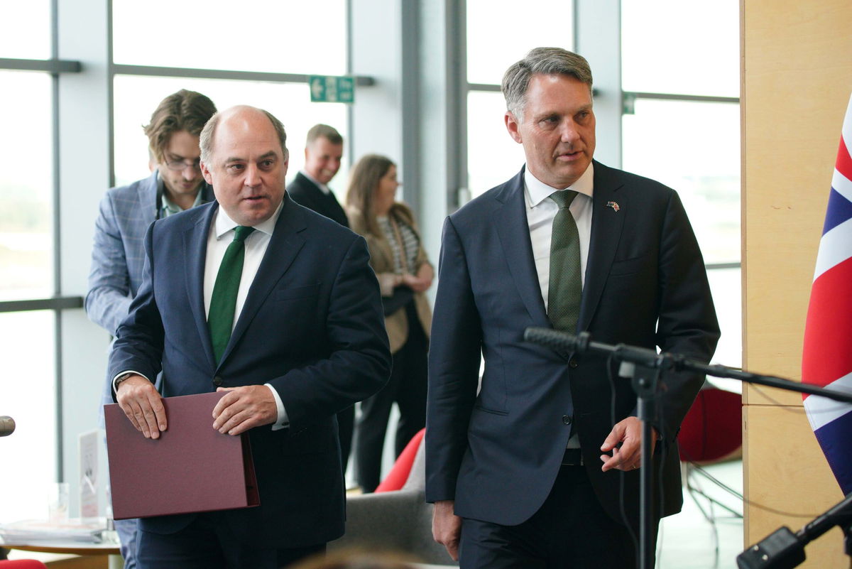 <i>Peter Byrne/PA Images/Getty Images</i><br/>UK Defense Secretary Ben Wallace (L) and Australian Deputy Prime Minister Richard Marles are seen here at BAE systems in Barrow-in-Furness on August 31.