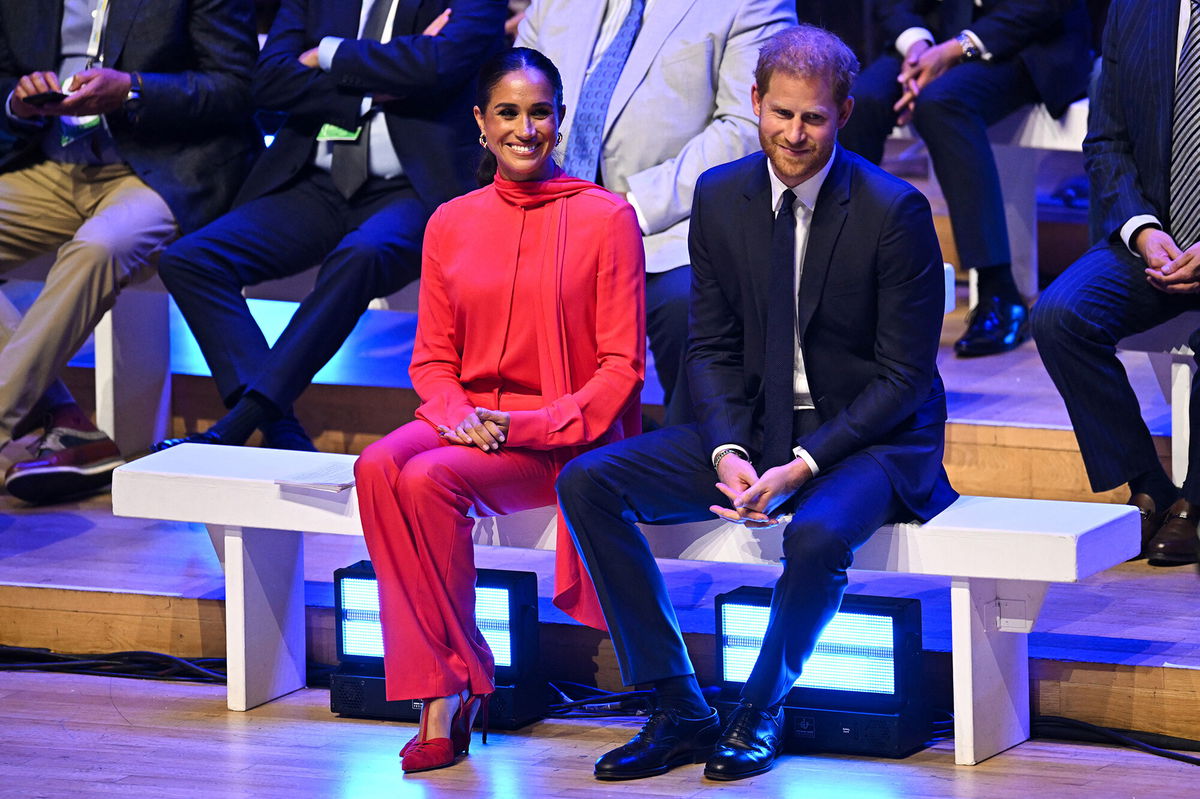 <i>Oli Scarff/AFP/Getty Images</i><br/>Meghan (left) was accompanied by her husband