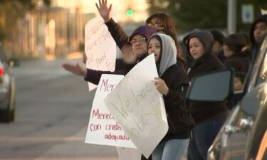 Parents and students staged a protest at St. Stanislaus school in East Chicago over administrators' decision to send home a teacher who admitted to having a "kill list" leave without contacting police first.