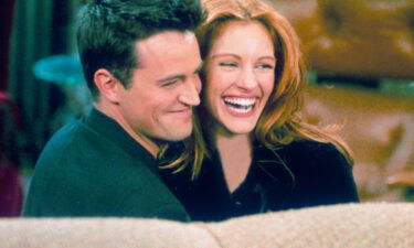 Matthew Perry and actress Julia Roberts hug each other on the set of "Friends" in 1996. Perry opens up in his new book about his attention-getting relationship with Roberts in the mid-1990s and the reason it came to an end.