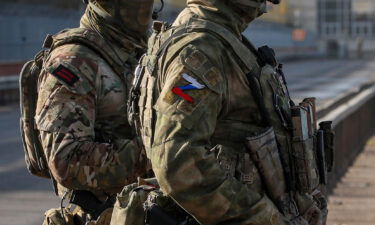 A picture taken during a media tour organized by the Russian Army shows Russian servicemen standing guard near the Kakhovka Hydroelectric Power Plant (HPP) on the Dnieper River in Kakhovka