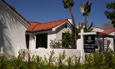 A realtor's 'for sale' sign is displayed outside a single-family home on September 22 in Los Angeles