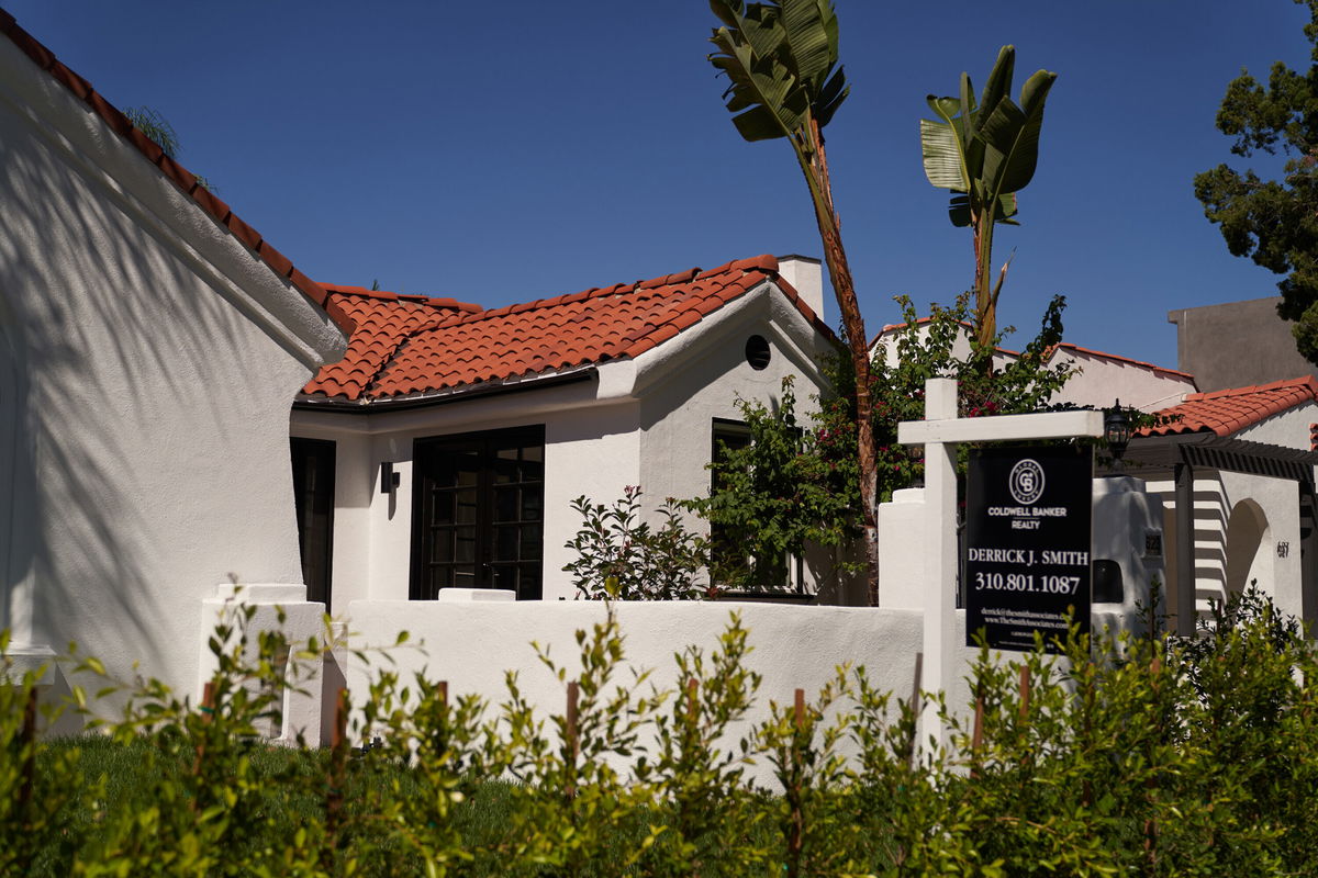 <i>Allison Dinner/Getty Images</i><br/>A realtor's 'for sale' sign is displayed outside a single-family home on September 22 in Los Angeles