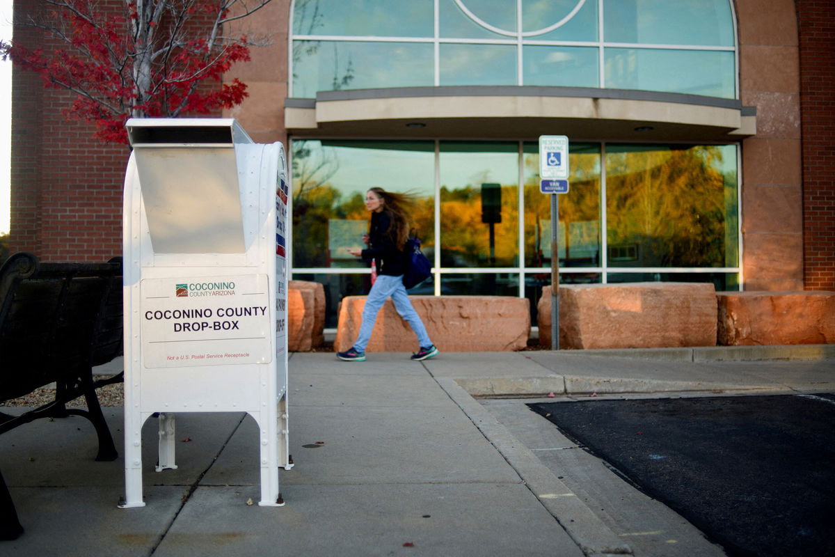 <i>Michael Patacsil/Reuters</i><br/>The Arizona and Michigan state Republican Parties are calling voters urging them to return their ballots by mail or to drop boxes in those battleground states