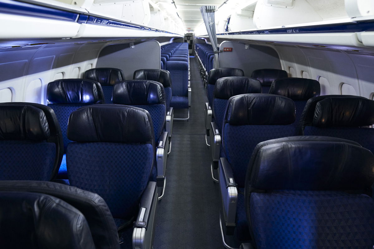 <i>Cooper Neill/Bloomberg/Getty Images</i><br/>American Airlines is dropping its first class cabins for more business class seats. Pictured are first and economy class cabins of an American Airlines aircraft at Dallas/Fort Worth International Airport on September 1