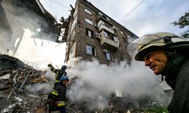 Ukrainian President Volodymyr Zelensky on Tuesday asked the Group of 7 nations to help his country establish an "air shield" against Russian aerial attacks. Pictured are rescuers in Zaporizhzhia