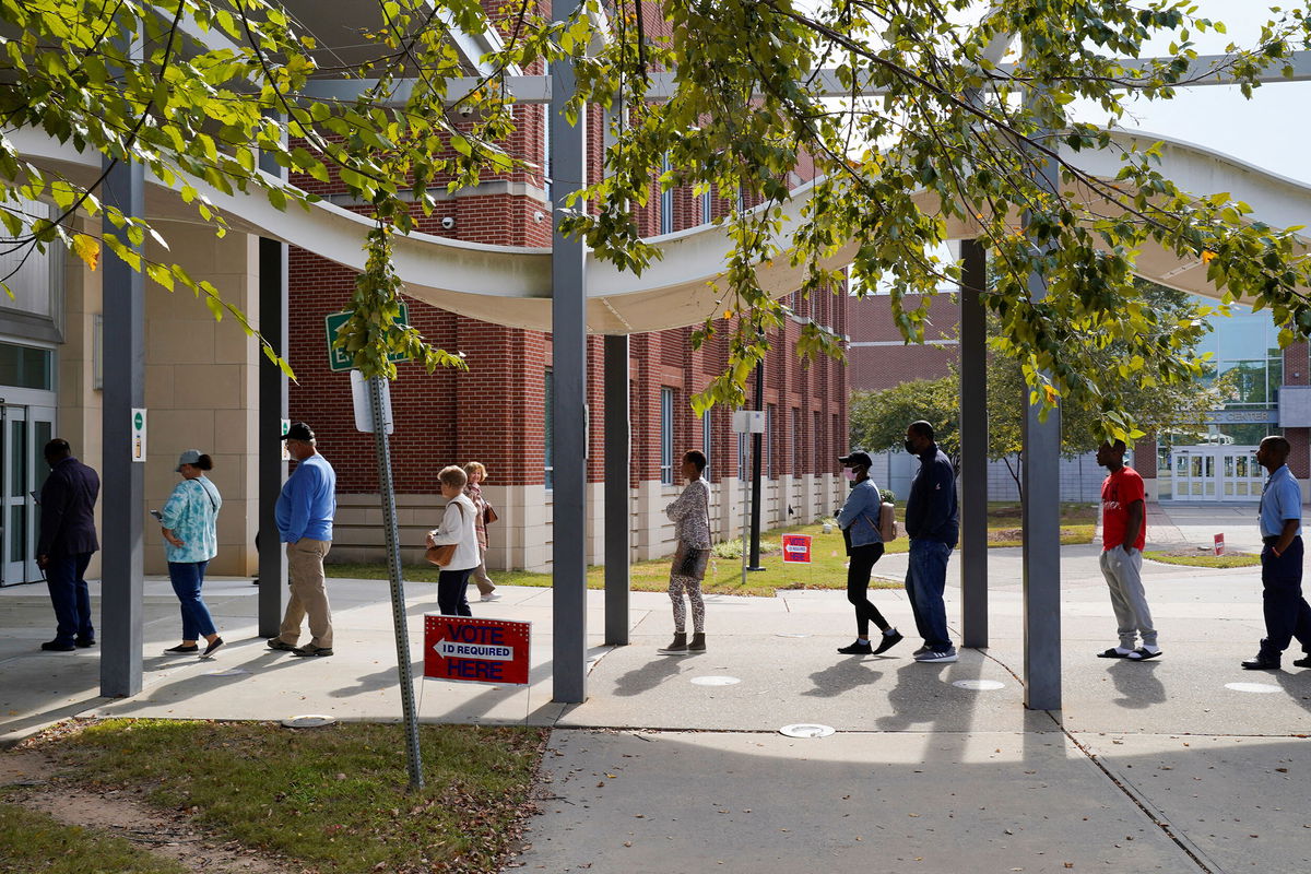 <i>Cheney Orr/Reuters</i><br/>A line of early voters stretches outside the building as early voting begins for the midterm elections at the Citizens Service Center in Columbus