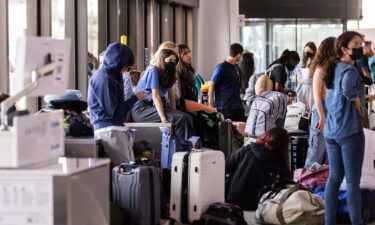 Major US airlines are criticizing the Biden administration's latest plans to publicize flight delay compensation. Travelers here wait at Newark Liberty International Airport on July 1