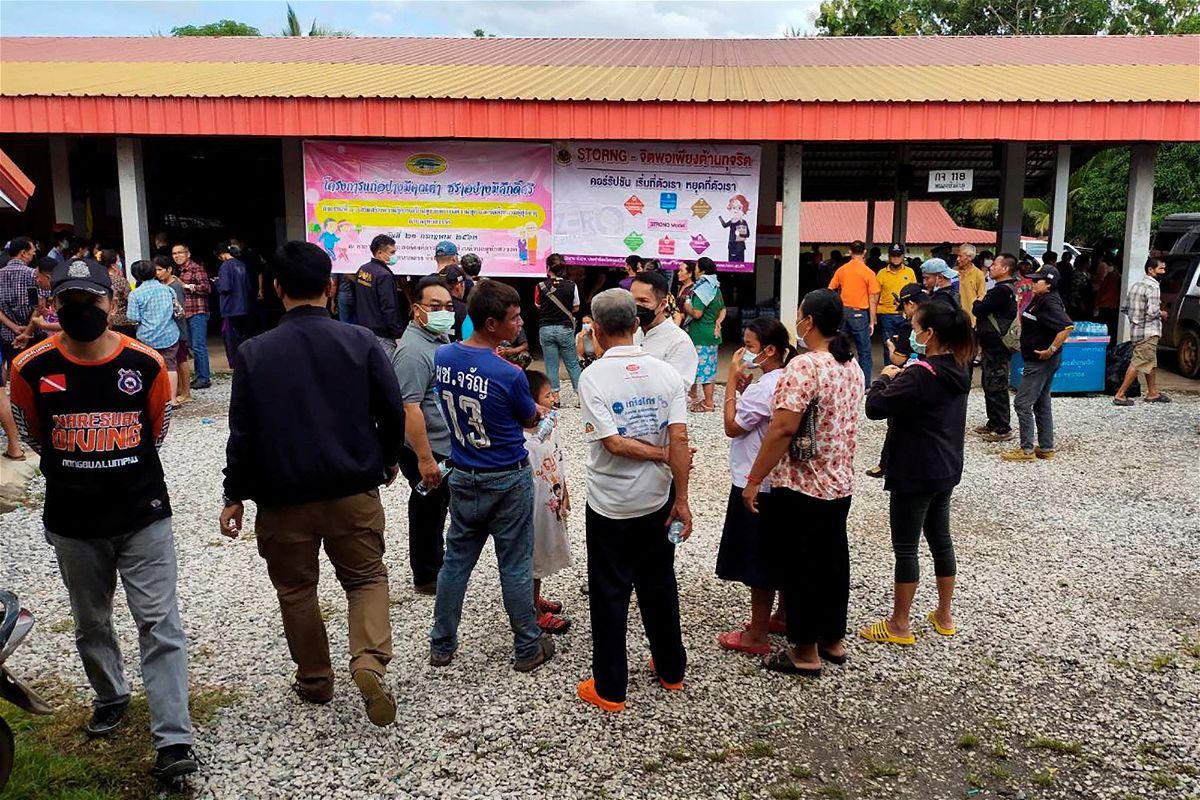 People gather outside of a daycare center's scene of a mass shooting in the town of Uthai Sawan, 500 km (310 miles) northeast of Bangkok in the province of Nong Bua Lamphu, Thailand October 6, 2022. Sakdipat Boonsom/Handout via REUTERS THIS IMAGE HAS BEEN SUPPLIED BY A THIRD PARTY. MANDATORY CREDIT. NO RESALES. NO ARCHIVES.
