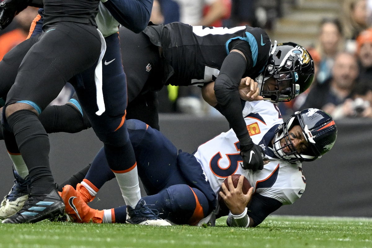 <i>AAron Ontiveroz/Denver Post/Getty Images</i><br/>Wilson is sacked by Jacksonville's Arden Key during the first quarter at Wembley Stadium.