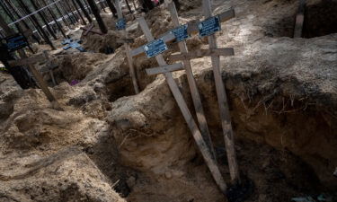 This image shows a mass burial site created during Russian occupation of Izium