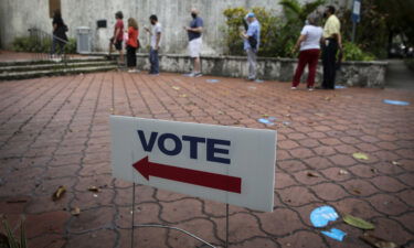 A Florida judge on Friday dismissed the case against a Miami man who was arrested on charges related to election fraud in August. A "Vote" sign is displayed in Miami on October 19