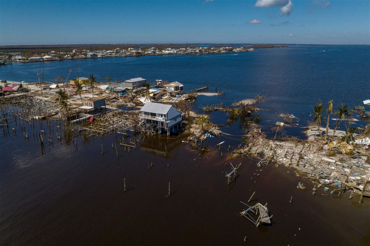 <i>Ricardo Arduengo/AFP/Getty Images</i><br/>An aerial picture taken on October 1 shows a broken section of the Pine Island Road and destroyed houses in the aftermath of Hurricane Ian in Lee County