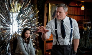 Ana de Armas as Marta Cabrera and Daniel Craig as Benoit Blanc in 'Knives Out' Film