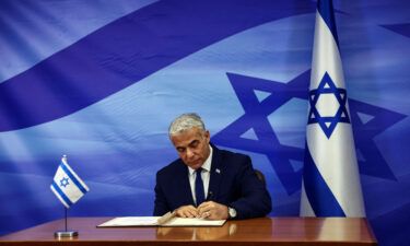 Israeli leader Yair Lapid signs the deal setting a maritime border between Israel and Lebanon