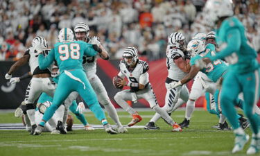 Joe Burrow runs with the ball in the second quarter against the Miami Dolphins.