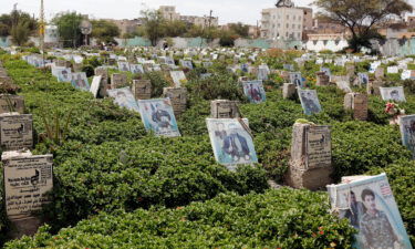 Yemen locals visit a cemetery with the graves of Yemenis who have lost their lives during the war