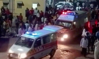 Ambulances arrive at a hospital following the collapse of the suspension bridge in Morbi. At least 60 people were killed in India on October 30 when a bridge collapsed in the western state of Gujarat.