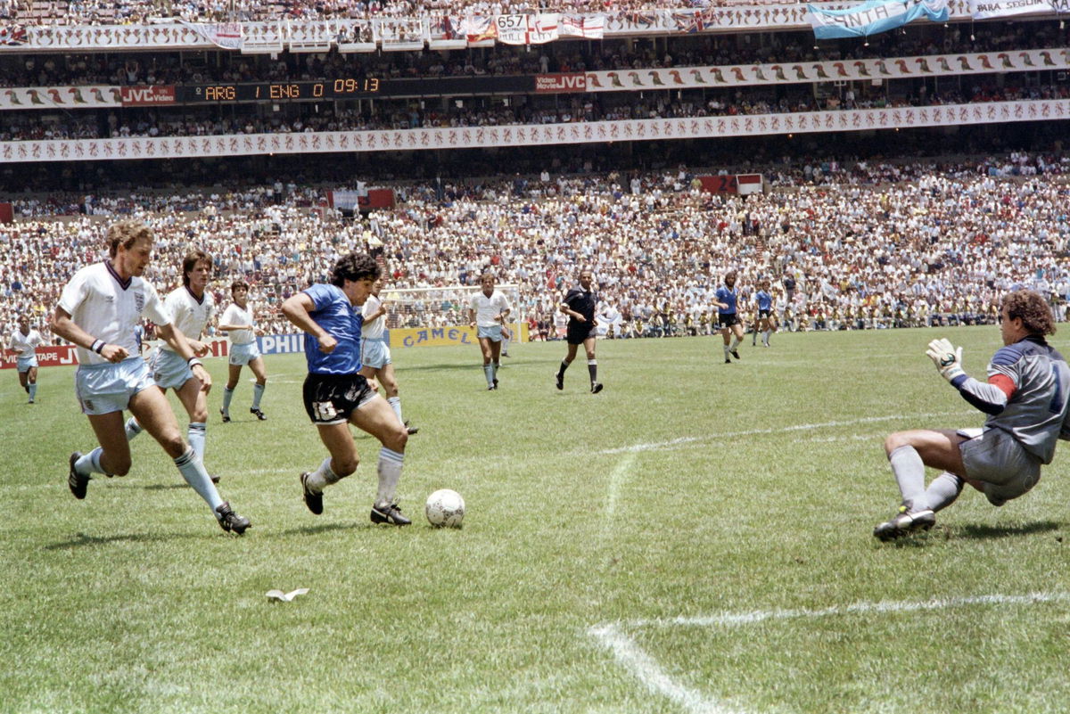 <i>Stringer/AFP/Getty Images</i><br/>Maradona scores against England at the 1986 World Cup in Mexico.