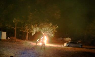 A motorcyclist erupts in flames after being tased by a Arkansas State Police trooper on October 13.