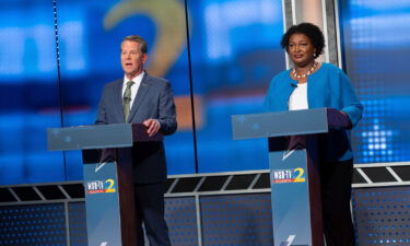 Republican Georgia Gov. Brian Kemp (left) and Democratic challenger Stacey Abrams face off in a televised debate in Atlanta on October 30.