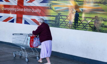 New UK prime minister faces huge economic and political challenges. A shopper is here seen outside an Aldi supermarket in Sheffield