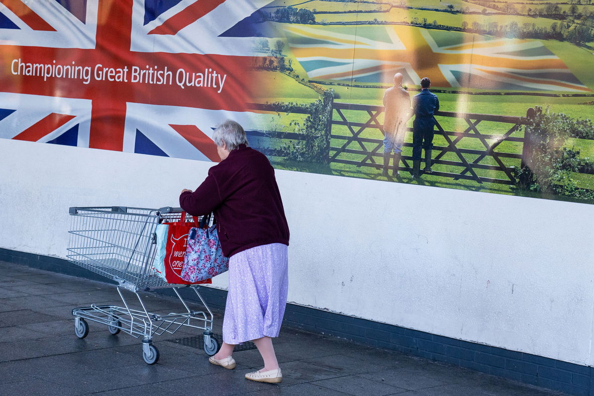 <i>Dominic Lipinski/Bloomberg/Getty Images</i><br/>New UK prime minister faces huge economic and political challenges. A shopper is here seen outside an Aldi supermarket in Sheffield