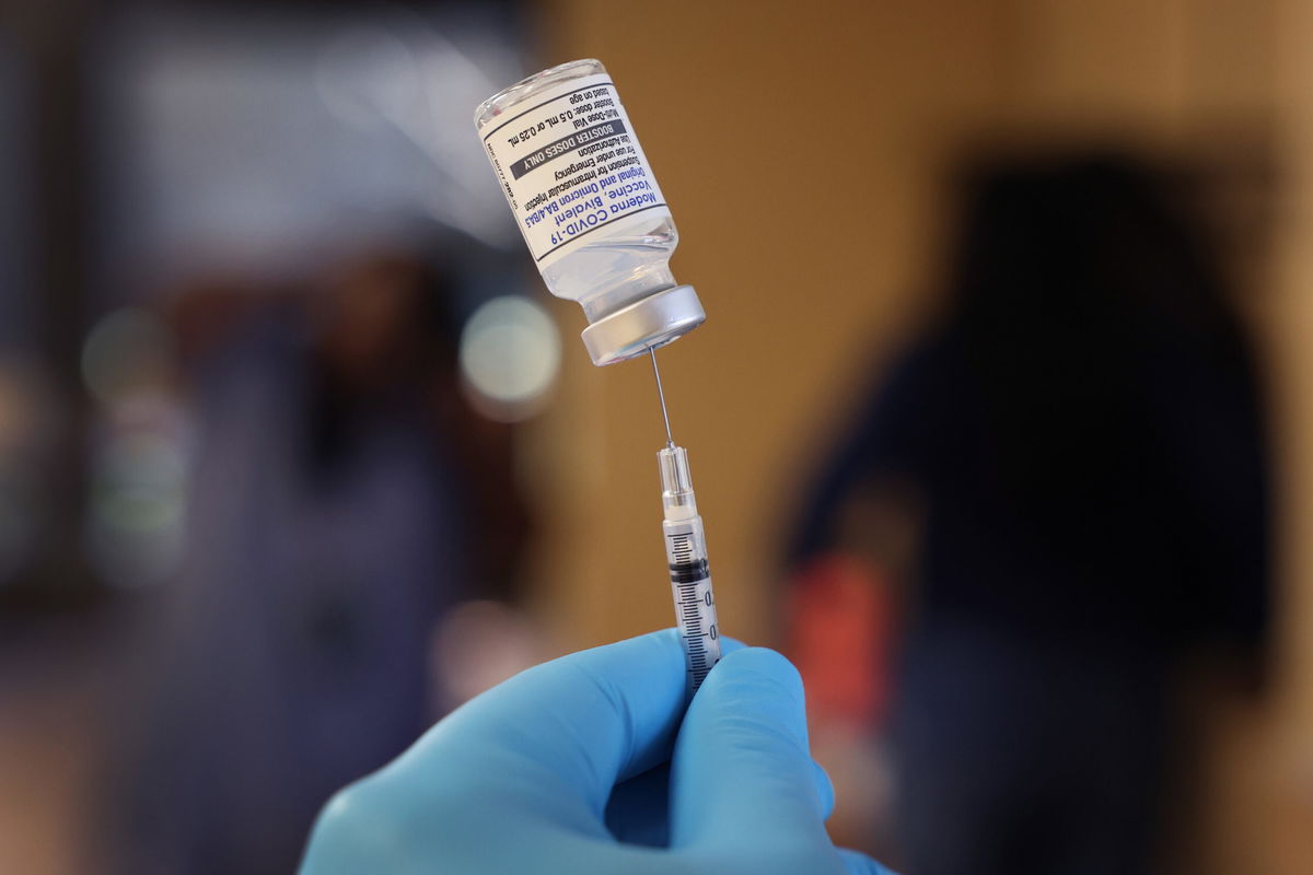 <i>Scott Olson/Getty Images</i><br/>A pharmacist prepares to administer Covid-19 vaccine booster shots on September 09