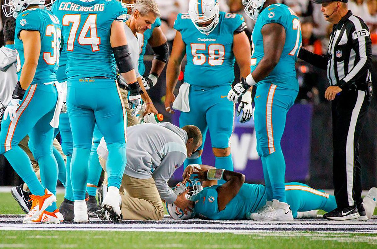 <i>David Santiago/Miami Herald/Tribune News Service/Getty Images</i><br/>Miami Dolphins quarterback Tua Tagovailoa (1) is attended by medical staff after being sacked on September 29 in Cincinnati