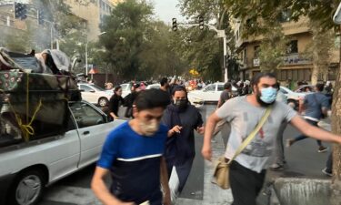 A picture obtained by AFP outside Iran shows demonstrators being dispersed during a protest for Mahsa Amini