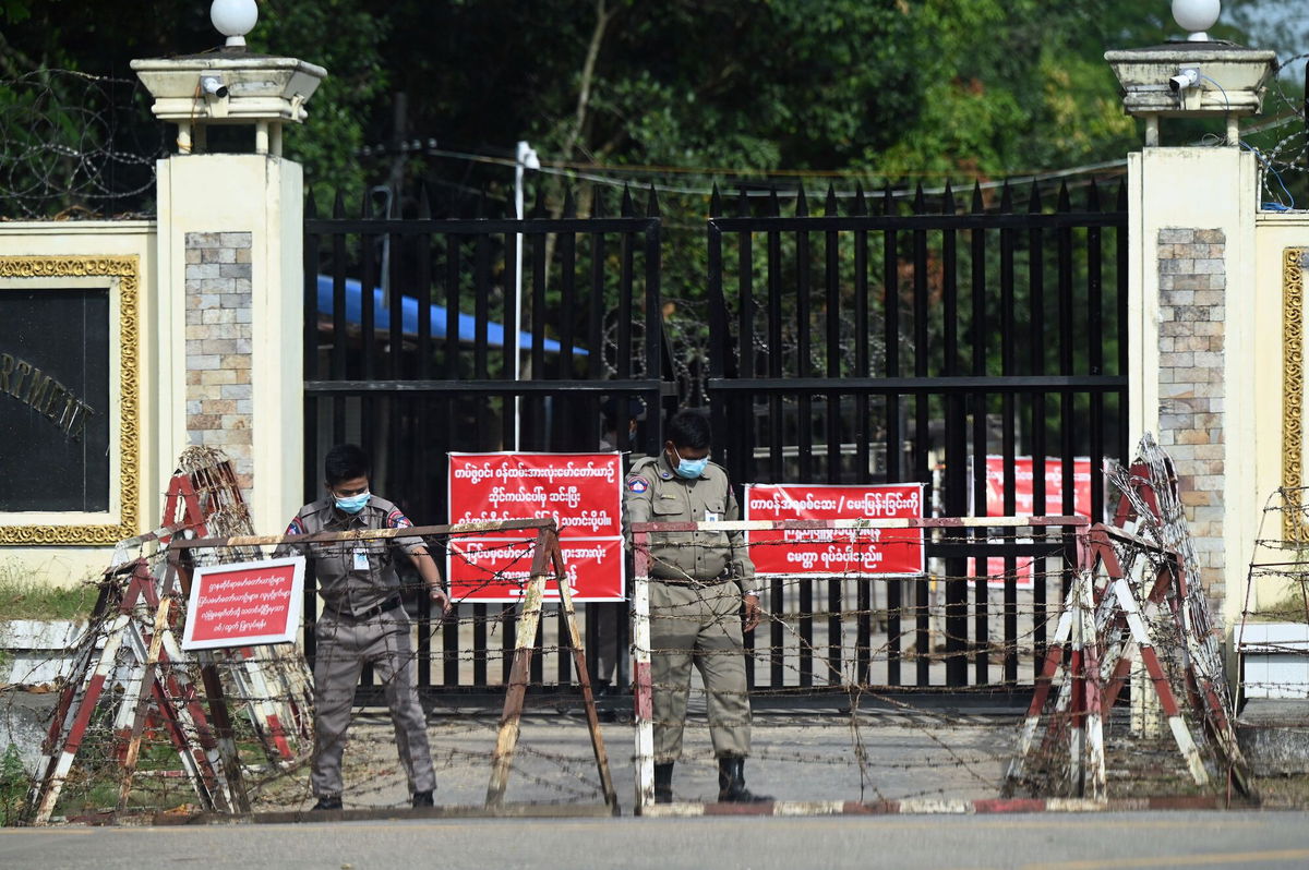 <i>Stringer/AFP/Getty Images</i><br/>Prison security officials prepare for the reported release of inmates outside Insein prison in Yangon.