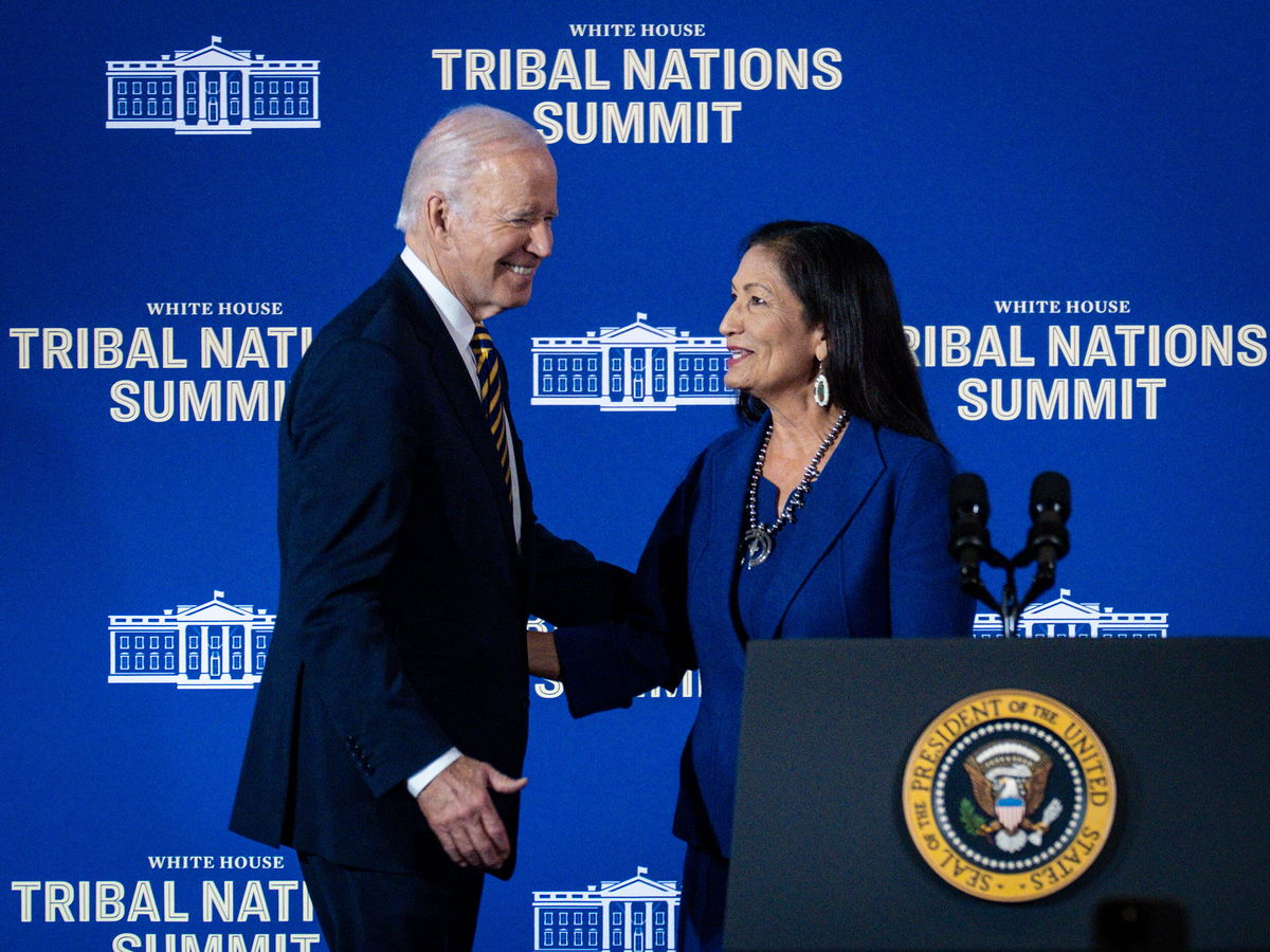 <i>Pete Marovich/Getty Images</i><br/>President Joe Biden greets Department of the Interior Secretary Deb Haaland during the 2022 White House Tribal Nations Summit at the Department of the Interior on November 30 in Washington