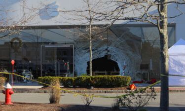 Two victims injured when a car drove into an Apple store filed lawsuits on November 29 claiming negligence. Seen here is a view showing the crash site after a vehicle crashed into an Apple store in Hingham