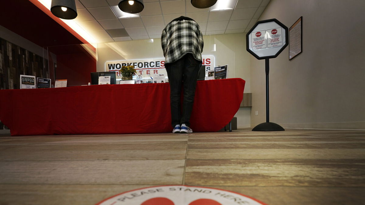 <i>LM Otero/AP</i><br/>A job seeker checks in at the RedBird Workforce Center in Dallas