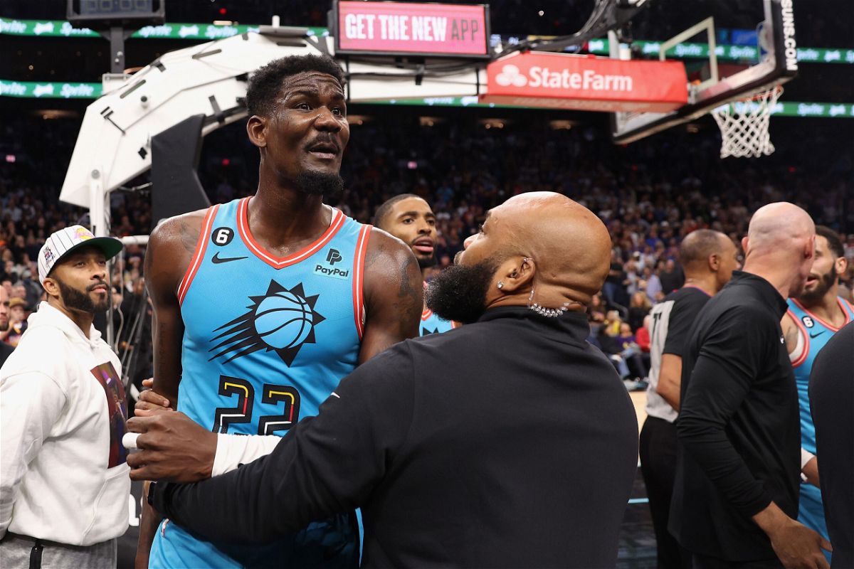 <i>Christian Petersen/Getty Images</i><br/>Deandre Ayton of the Phoenix Suns is restrained after being pushed to the court on November 22.
