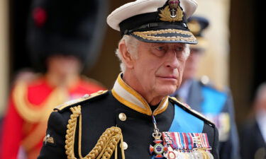 King Charles III follows the hearse with the coffin of Queen Elizabeth II moving towards St. George's Chapel at Windsor Castle during the State Funeral of Queen Elizabeth II on September 19 in Windsor