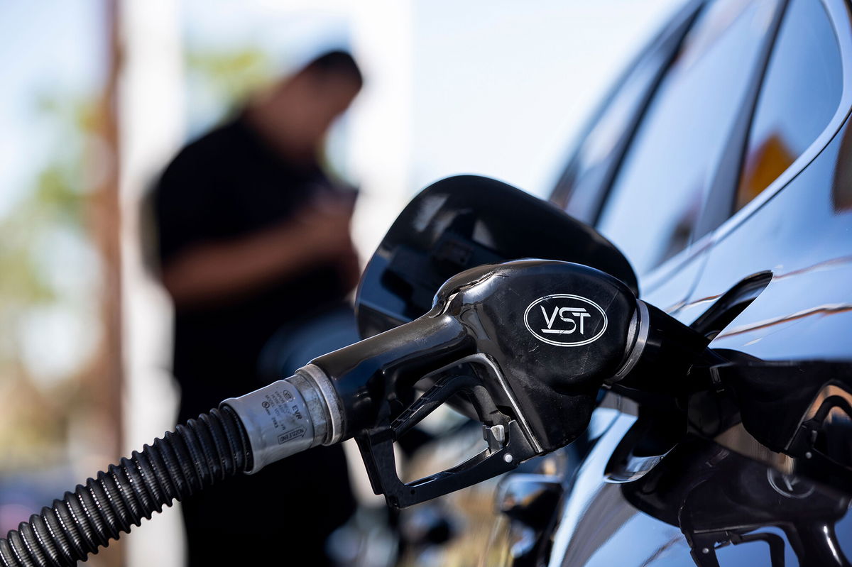 <i>Etienne Laurent/EPA-EFE/Shutterstock</i><br/>A man refuels his car at a gas station in Carson