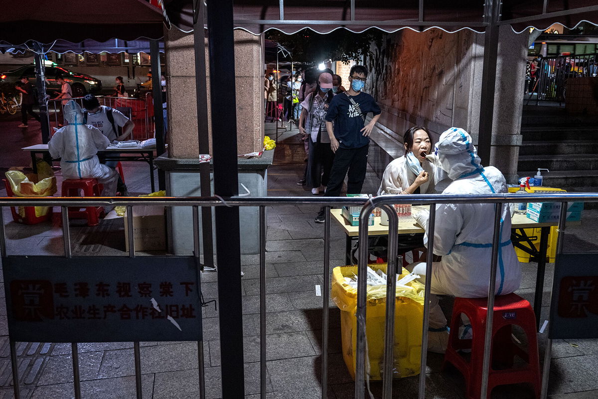 <i>VCG/Visual China Group/Getty Images</i><br/>Residents queue up for Covid-19 tests on October 31 in the southern city of Guangzhou.